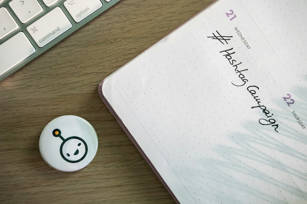 person writing in journal